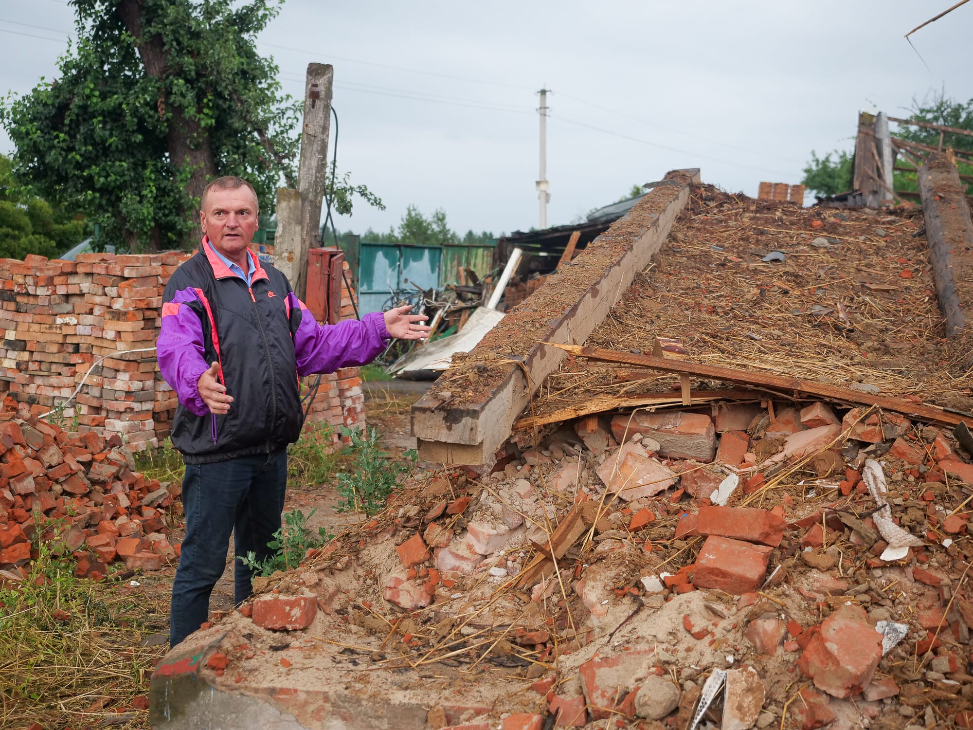 Serhiy Kolevych (47) stands in front of the ruins of his house. During the first air raid on March 14, he was in the building with his wife, niece and nephew and was injured. During the second attack, which completely destroyed the house, he was already staying with neighbors.